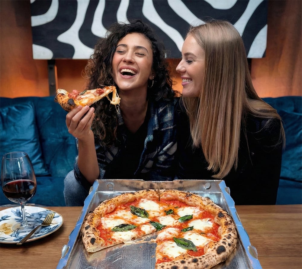 Happy customers enjoying Neapolitan pizza from Papaiolo restaurant Prague